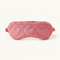 Rose-pink sleep mask with heart quilting and a side strap