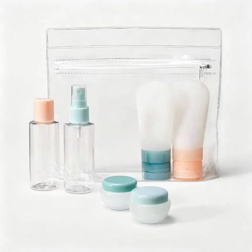 Seven-piece travel toiletry kit with clear pouch, bottles, squeeze tubes and jars